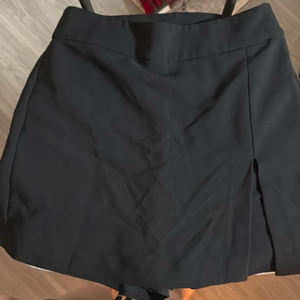 Priceless Black Skort. Medium. Formal but cute! $20